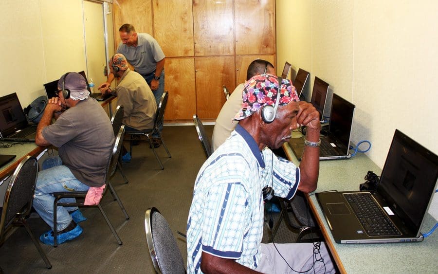 LWCC Loss Prevention Outreach Coordinator Richard Perkins assists Twin Brothers Marine employees as they update their safety training. The center is fully insulated and climate-controlled and can accommodate 11 learners. Photo courtesy of LWCC 