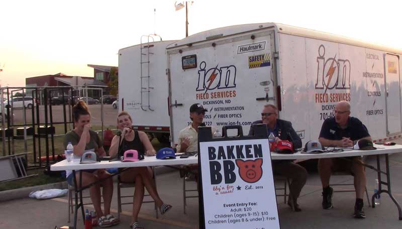 Living the Crude Life live recording session at the Bakken BBQ in Dickinson, ND. Host Jason Spiess (middle) moderates the discussion of “How Oil and Gas Builds Culture and Communities” with the co-founders of the Bakken BBQ, Jackie Jenkin (left) and Tiffany Steiner (middle left); Mayor of Bismarck (ND) Steve Bakken (middle right), and Patrick Bertagnoli, community enhancement director, City of Watford City (right).