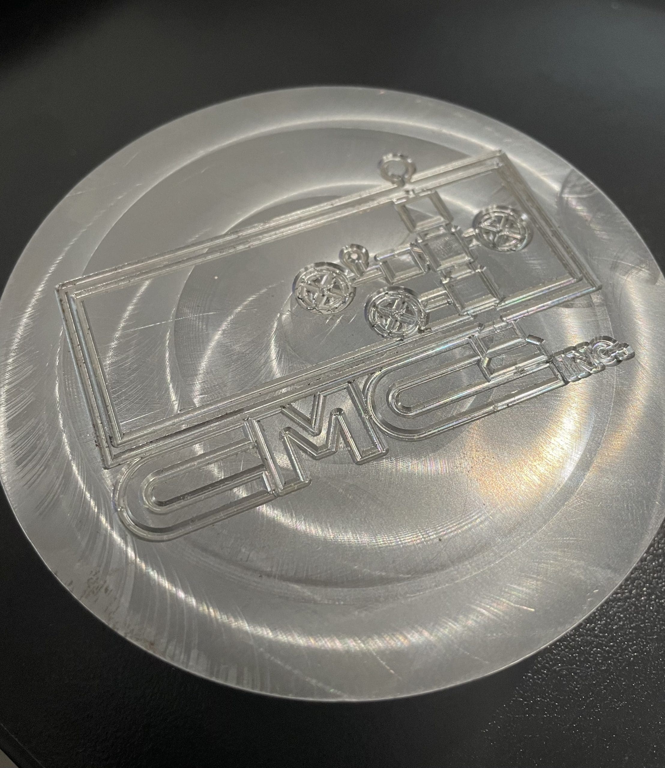 The machined logo (above).
