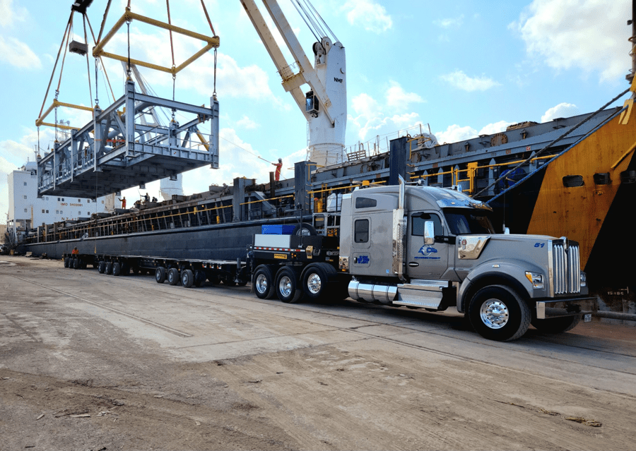 Control module being hauled on the Faymonville Highway Max. This was a live offload off of a ship, so it had to stage close by the ship and wait to be offloaded. Using the Highway Max with the ability to stretch out to 90’ to support this load and be able to make the turns into site was a must.