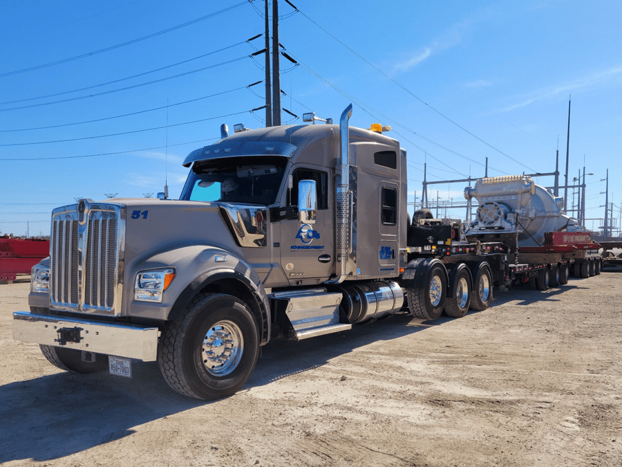 Truck with a six-axle trailer hauling a main air blower turbine for a refinery. The blower was brought to Houston from OH to be repaired and then return to OH. The facility was so tight with the turns the Faymonville Multimax steerable trailer had to be used to steer the trailer around all the obstacles inside the plant to avoid damages.