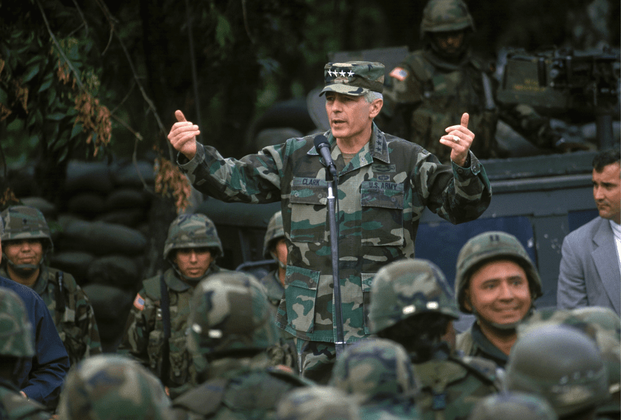 Addressing the troops with President Bill Clinton, Skopje, Macedonia, June 1999.