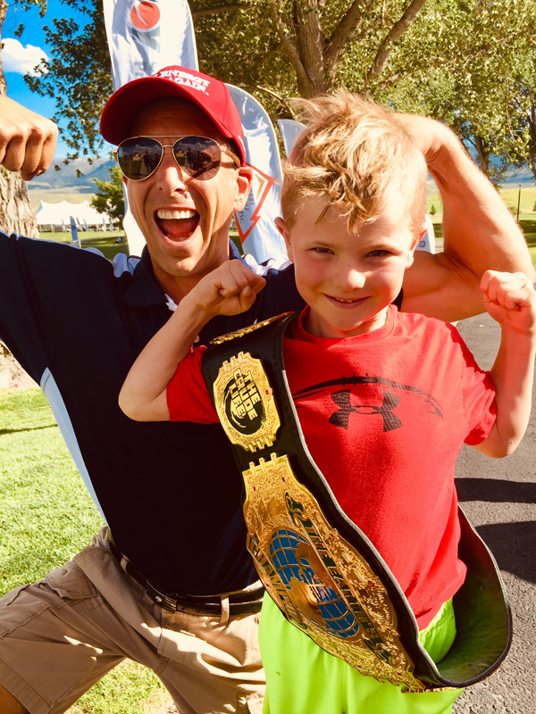 Future Johnny Green energy champions hoisting the championship belt.