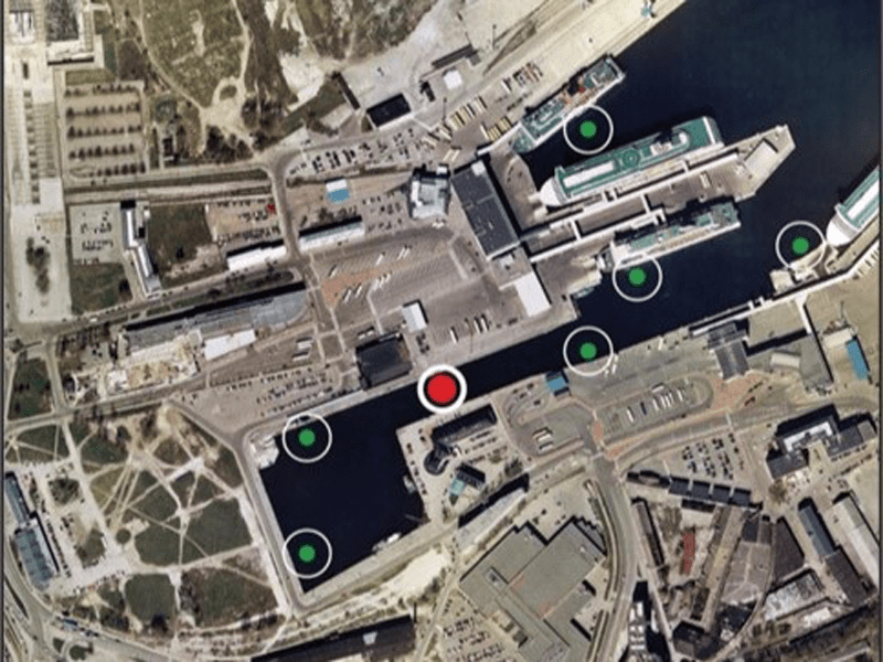 Image 6: Network of sensors at seaport, one detecting oil on water.