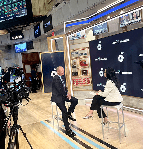 David Lawler being interviewed at the New York Stock Exchange (NYSE).