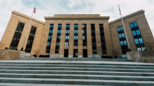 Fed building facade against stairs in city