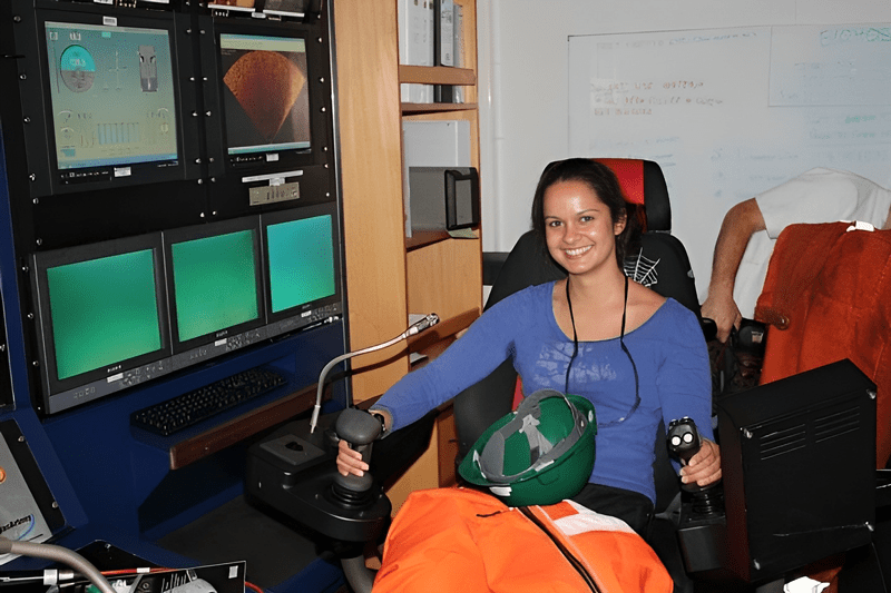 Lauren Neal on a vessel in the Atlantic (off the coast of Cornwall, UK). Project engineer at J P Kenny, offshore on night shift, where the ROV (remotely operated vehicles) team let Neal fly the ROV during a pre-lay survey of a power cable. (August 2010.)