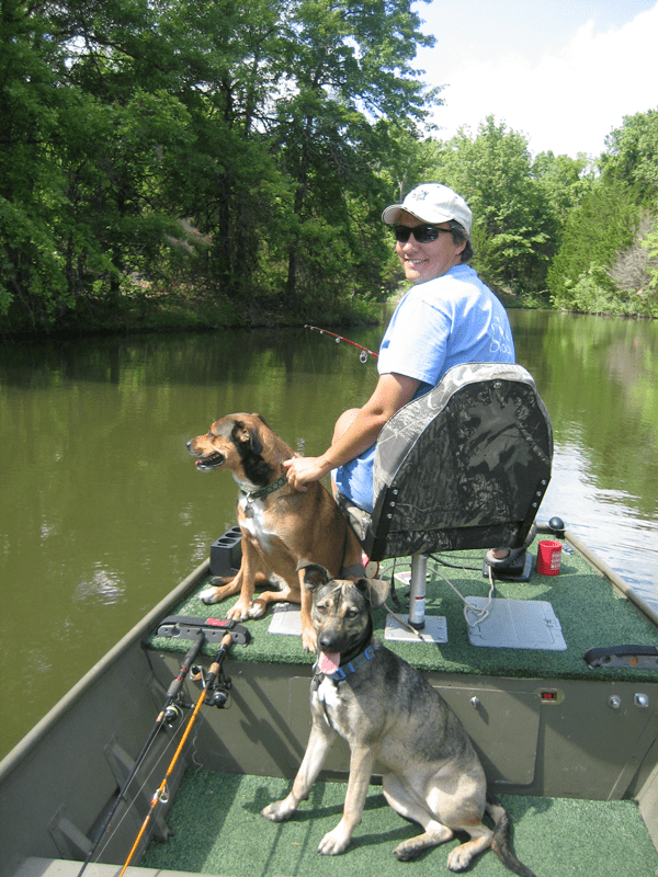 Jennifer Miskimins bass fishing on her aunt’s property in Missouri on ponds created from reclaimed coal mines, with Kensi (red) and Zoey (gray) joining her. Photos courtesy of Jennifer Miskimins.