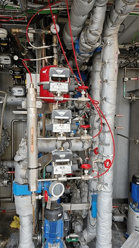 Figure 3. Sampling location for the three process gas streams, showing selector valves and the manifold. Sample gas to analyzers is taken from the top of the manifold while excess gas is vented from the bottom.