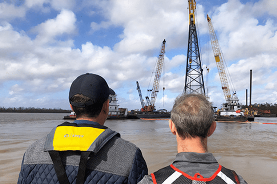 Emergency response personnel survey the cleanup of an oil spill. Photos courtesy of Forefront Emergency.