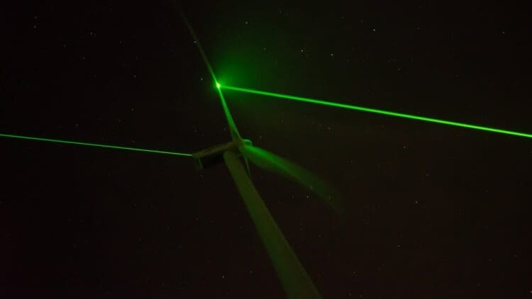 wind turbine emitting light at night