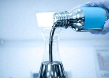 solar paint liquid poured into beaker