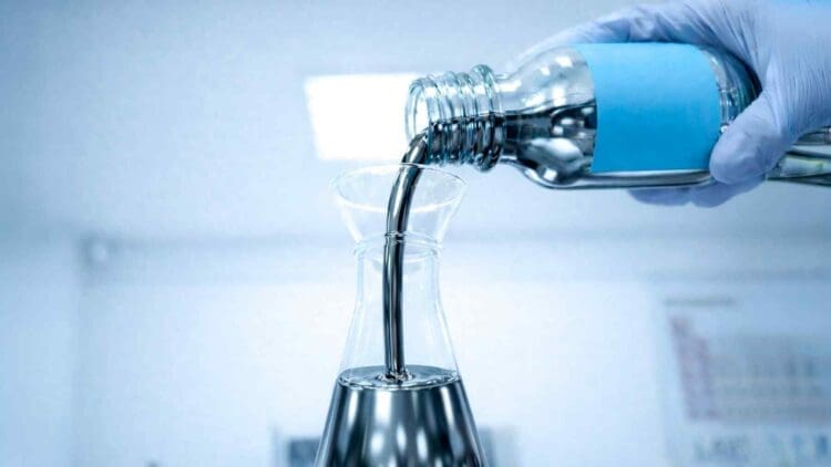 solar paint liquid poured into beaker