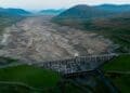 a hydroelectric dam's dried up reservoir