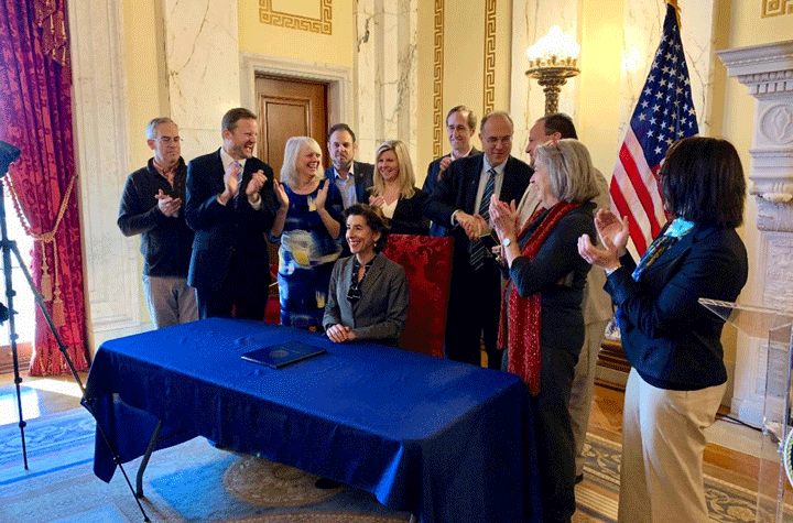 Gov. Gina Raimondo signing the executive order January 17, 2020, to advance a 100 percent renewable energy future for Rhode Island. Photo courtesy of State of RI.