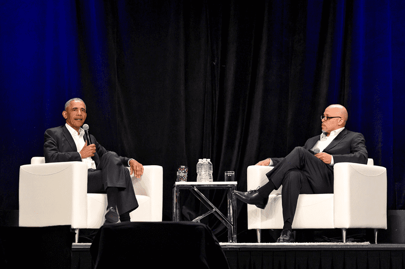 Dennis Kennedy (right) moderating a Q & A with former President Barack Obama at the 2019 National Diversity and Leadership Council.