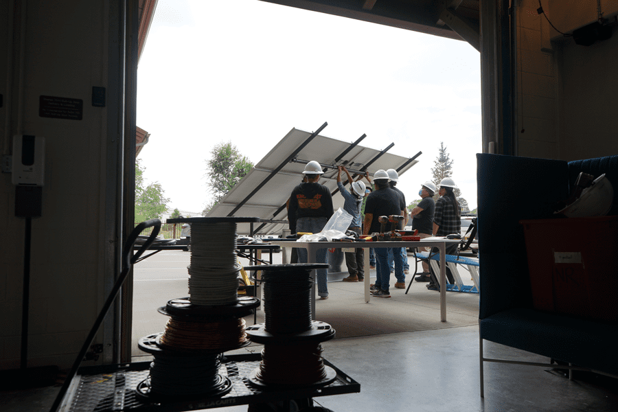 Deb Tewa leading solar panel installation training in Flagstaff, Arizona. Photo courtesy of the American Indian Science and Engineering Society.