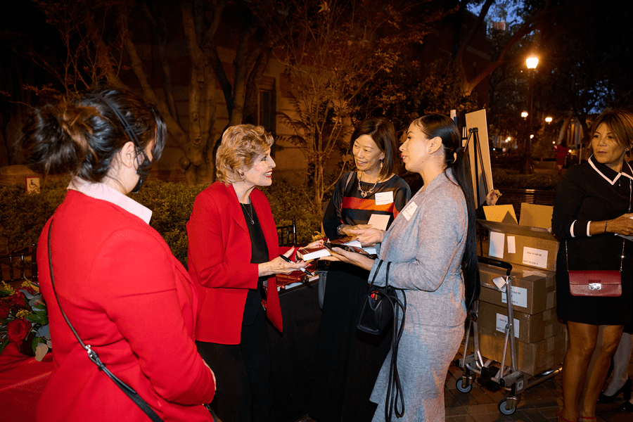 Betsy Berkhemer-Credaire signing copies of her book, Winning the Board Game: How Women Corporate Directors Make THE Difference (Angel City Press; 2nd edition. November 2019) at the October 2022 Los Angeles Strategic Networking Event. Photo courtesy of Sheldon Botler Photography.