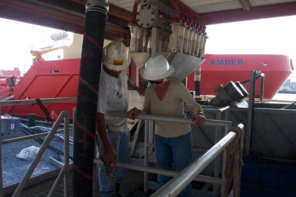 Lori Davis observes Rig-Chem’s products at work. The systems are used for boat cleaning at the shore base. With proper, efficient cleaning, these large vessels have a quicker turnaround time and reduce overall cost. (Port Fourchon, Louisiana, 2007.)