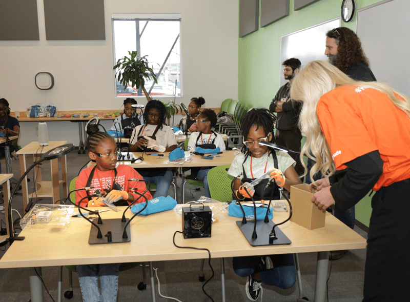 Black Girls Do Engineer student members learning to solder at BGDE S.T.E.M. Day, Houston, Texas.