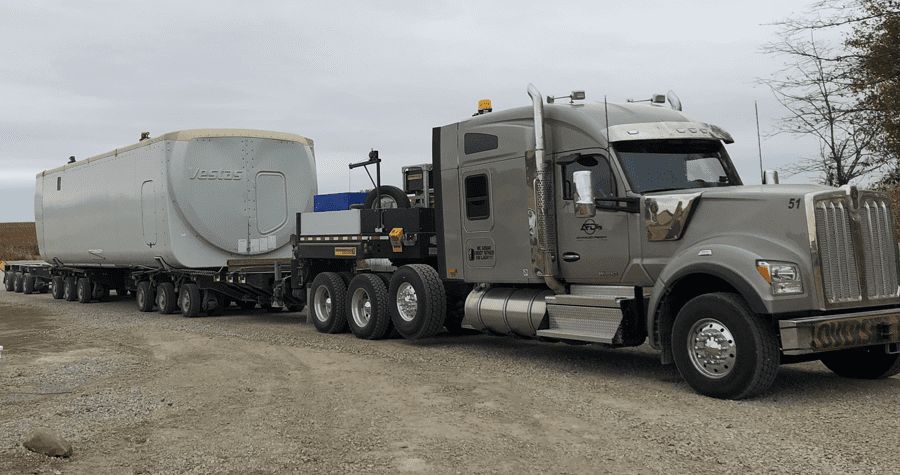 An AFD rig hauls a nacelle, which houses the inner workings of a wind turbine.