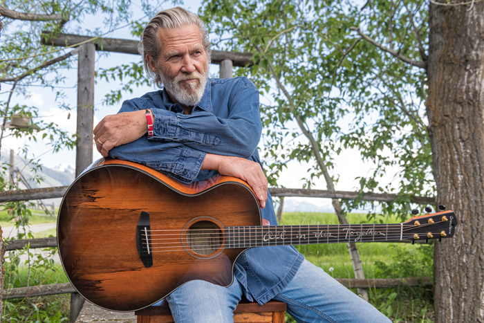 Jeff Bridges with his Signature Oregon Concerto Bourbon CE guitar created in collaboration with Breedlove. Photo courtesy of Jeff Bridges. Photography by Audrey Hall. www.audreyhall.com