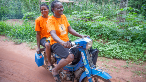 Eucharia Idoko on her motorbike with SSE Judith Ogbonna at a Sisterhood meeting in Enugu Ikpamodo village, Enugu State, Nigeria. Photos courtesy of Solar Sister.