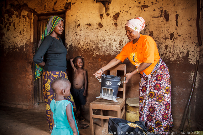 SSE Fatma Mziray, 38, delivers a clean wood cookstove to Ester Hodari, 22. Mforo, Tanzania, a village near Moshi, Tanzania.