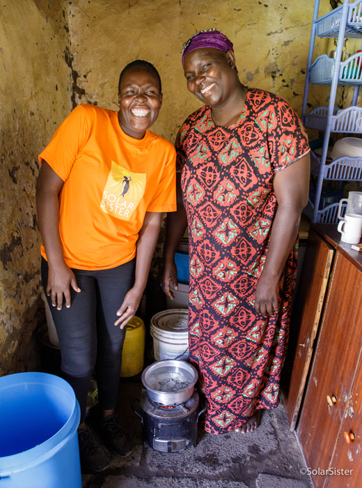 Kenyan Solar Sister sales agent Leonida Odour, 26, with customer, Helen, who purchased a clean cookstove.