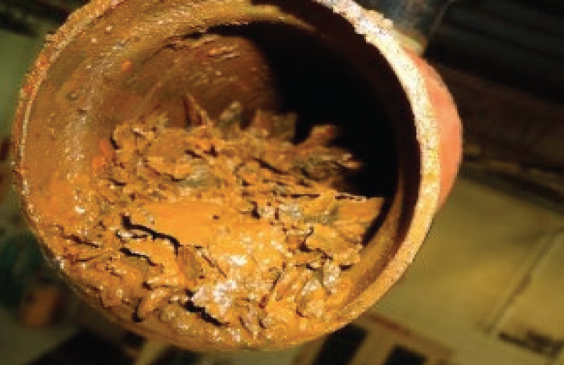 Iron oxide rust contamination built up in piping resulting from black powder build up.