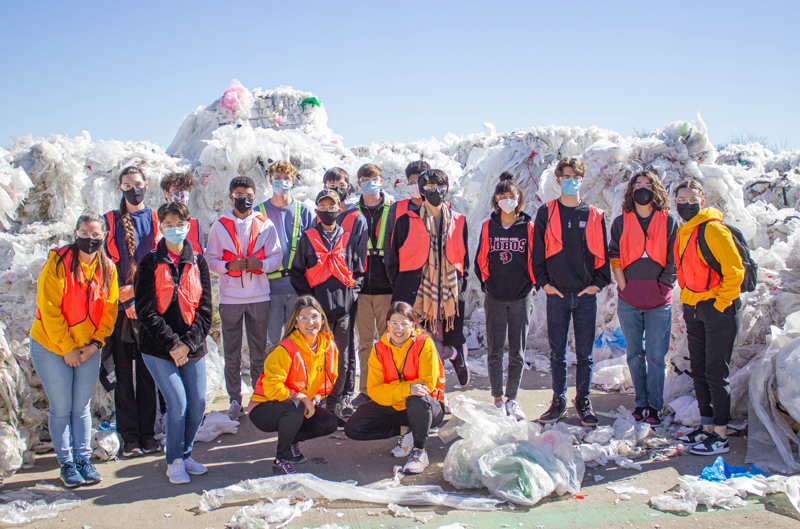 Students visited Natura PCR, a plastics recycling center in Houston, Texas. The group posed for a photo amid large piles of recyclable plastic.Photos courtesy of Puranik Foundation.