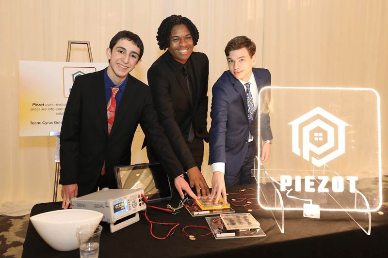 Team Piezot displayed its prototype at the Lotus Awards. The team developed a piezoelectric tile designed to generate energy in areas with high foot traffic.
